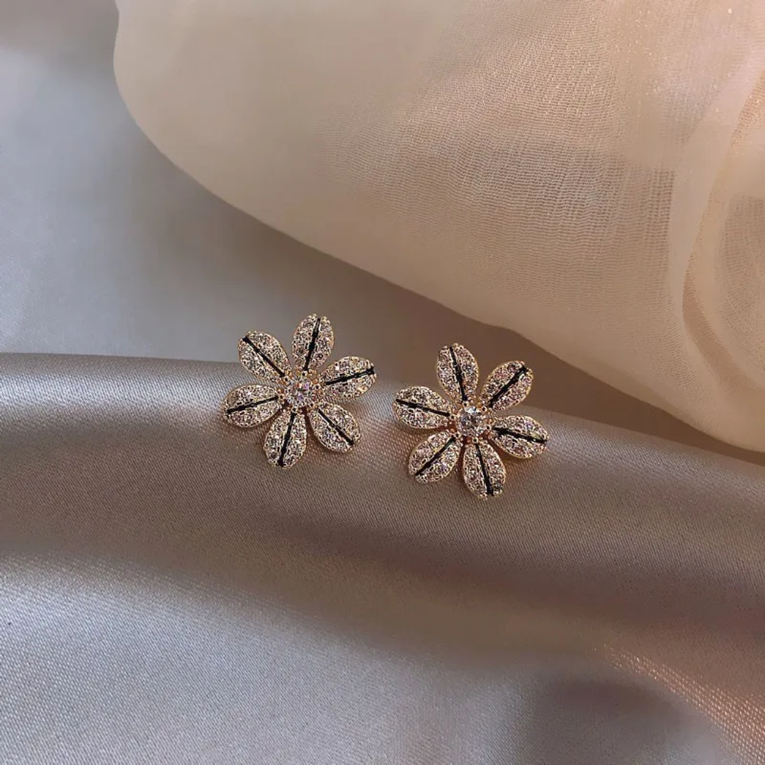 Arete flor con zircón