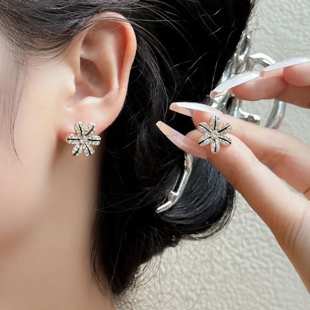 Arete flor con zircón